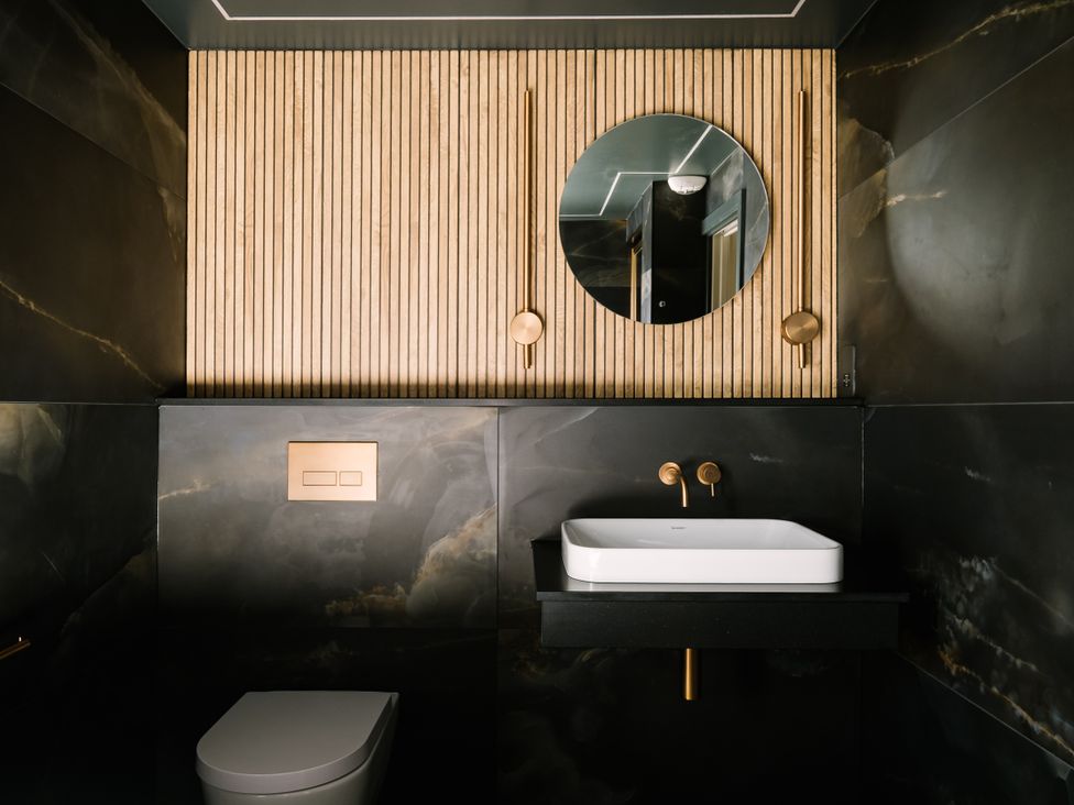 A bathroom with a sink and toilet at Bounty Boutique on the Lakes in Bowness-On-Windermere