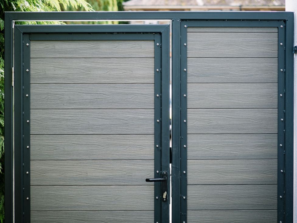 A double gate with a lock at Bounty Boutique on the Lakes in Bowness-On-Windermere