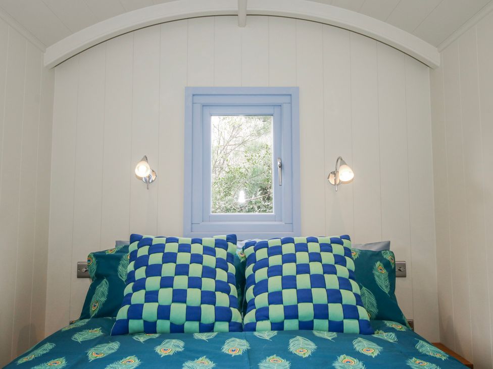 A bedroom with a bed and window at Skye in Clee Hill