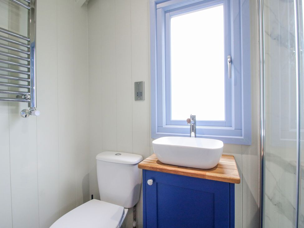 A bathroom with a toilet and wash basin at Skye in Clee Hill