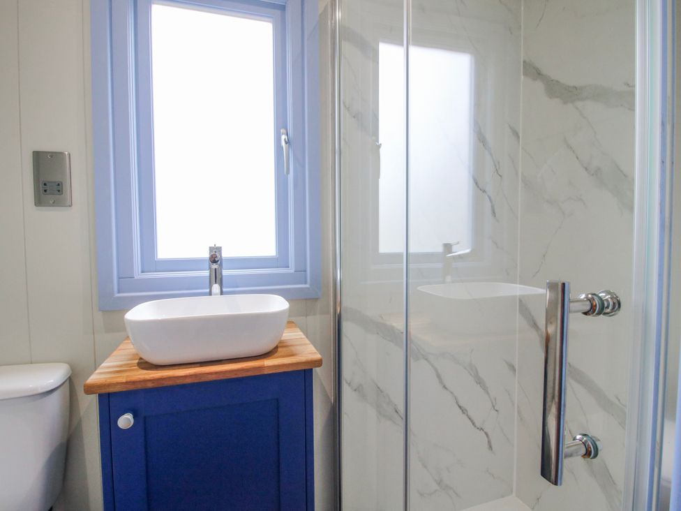 A bathroom with a sink and shower at Skye in Clee Hill