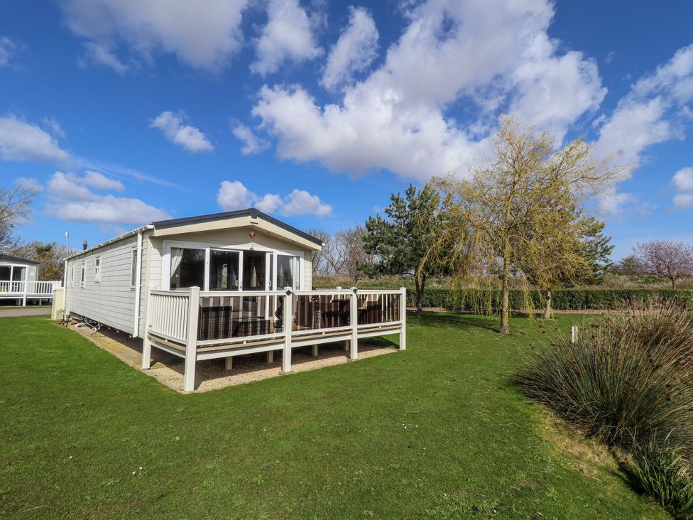 A holiday home with a deck in an outdoor area at 13 The Lakes Mablethorpe