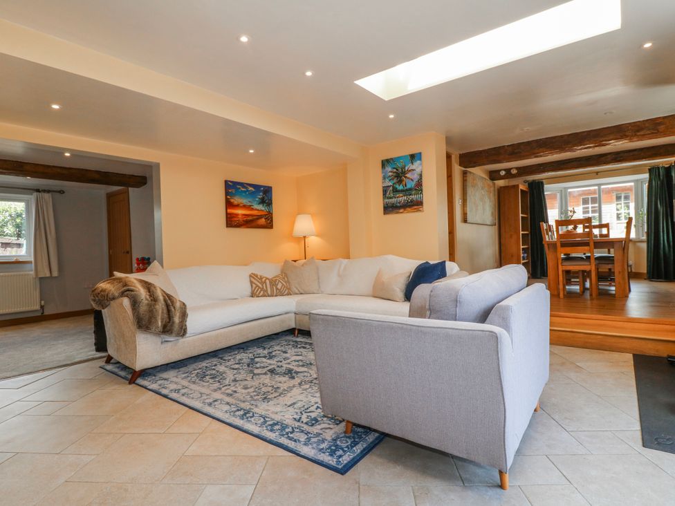 A living room with a sofa and table at Brecks Cottage in Moorhouse near Tuxford