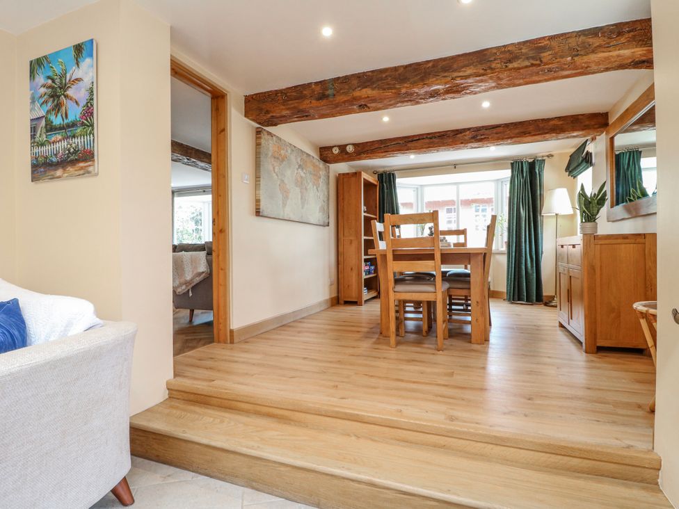 A dining room with a table and chairs at Brecks Cottage Moorhouse near Tuxford