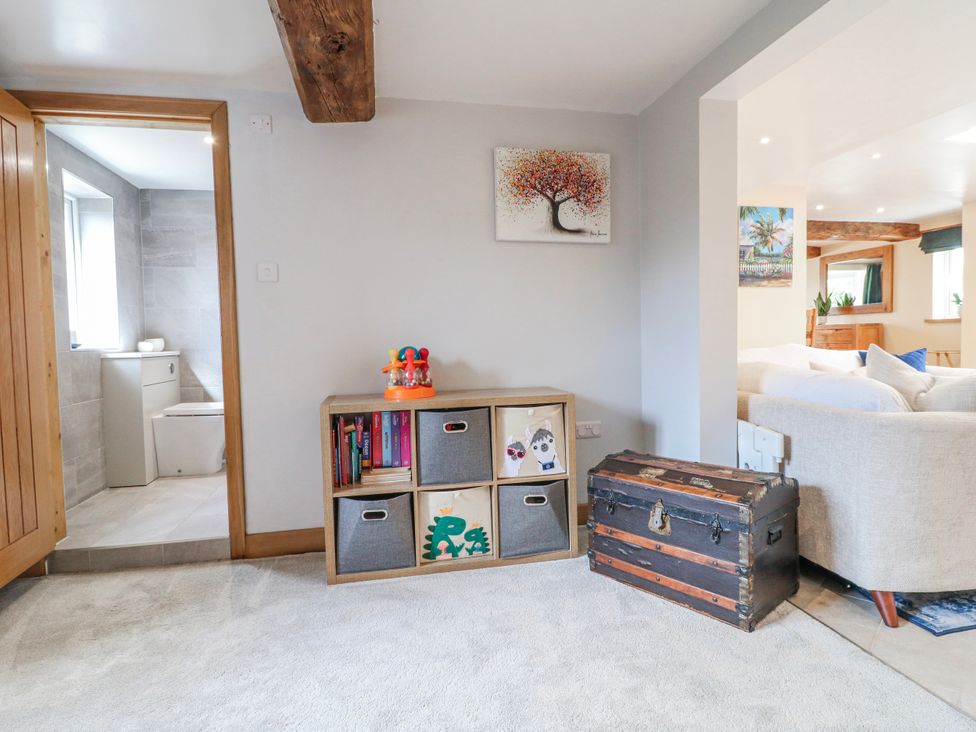 A hallway with a shelf and a trunk at Brecks Cottage Moorhouse near Tuxford
