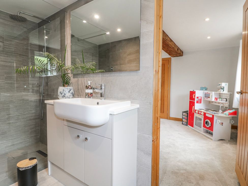 A bathroom with a sink and shower at Brecks Cottage Moorhouse near Tuxford