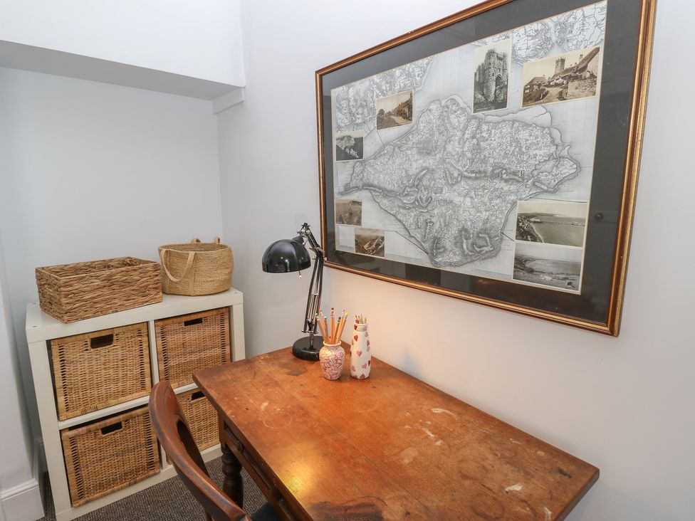 An office with a desk and wall map at Bay Tree Cottage Shanklin