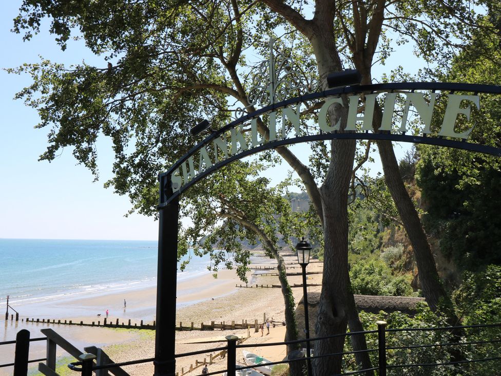 A beach view with a sign at Shanklin Chine in Shanklin