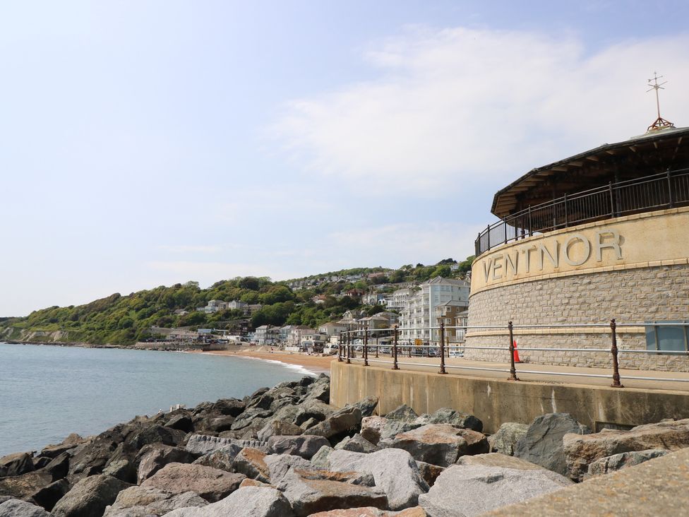 A coastline with rocks and a building at Ventnor on the Isle of Wight
