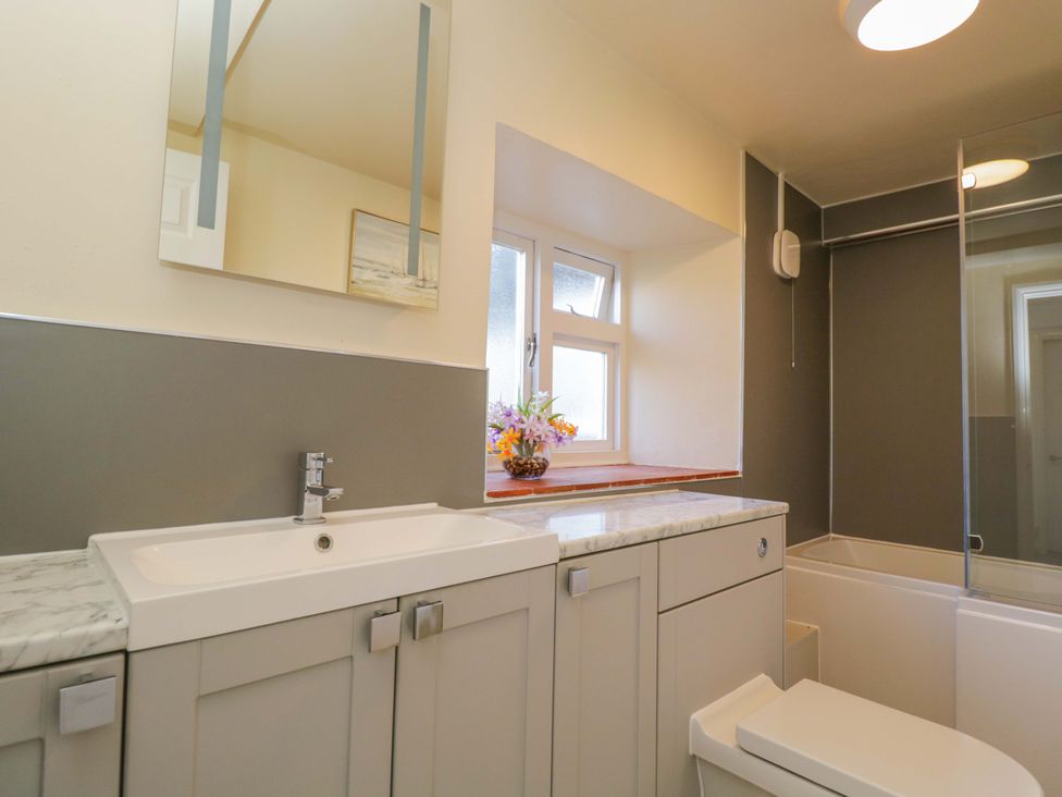 A bathroom with a sink and bathtub at 3 Woods Farm House in Chippenham