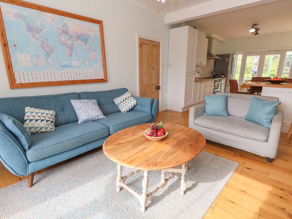 A living room with a sofa and coffee table at Millmead House Portesham