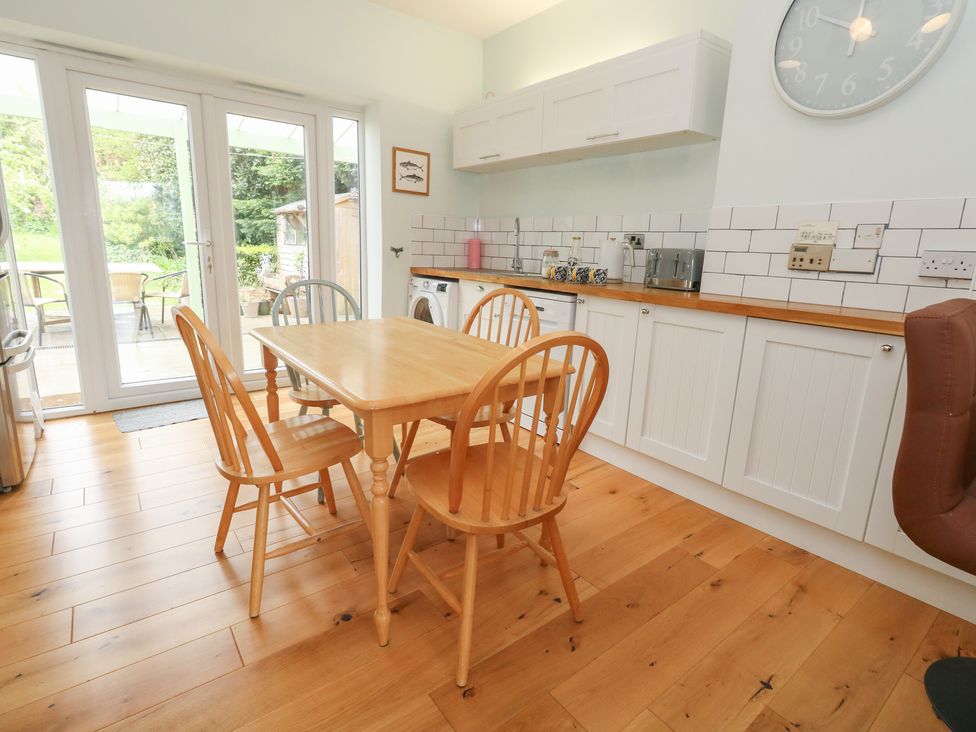 A kitchen with a table and chairs at Millmead House Portesham