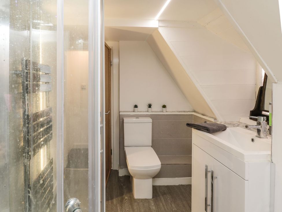 A bathroom with shower, toilet, and sink at 47A Baxtergate in Whitby