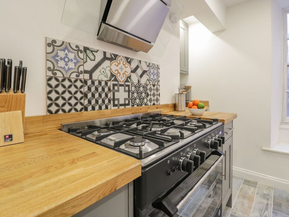 A kitchen with a stove and countertop at 47 Baxtergate Whitby
