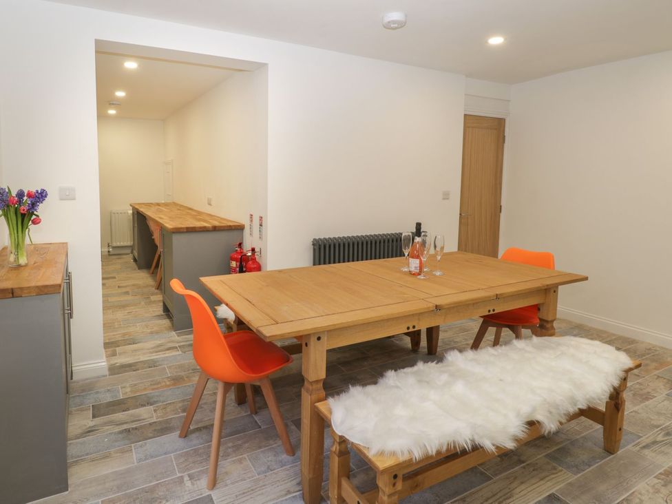 A dining room with a table and chairs at 47 Baxtergate, Whitby