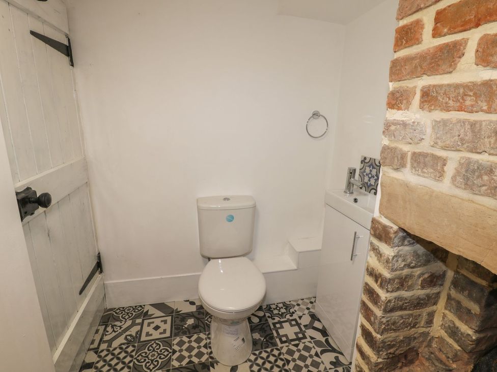A bathroom with a toilet and wash basin at 47 Baxtergate in Whitby