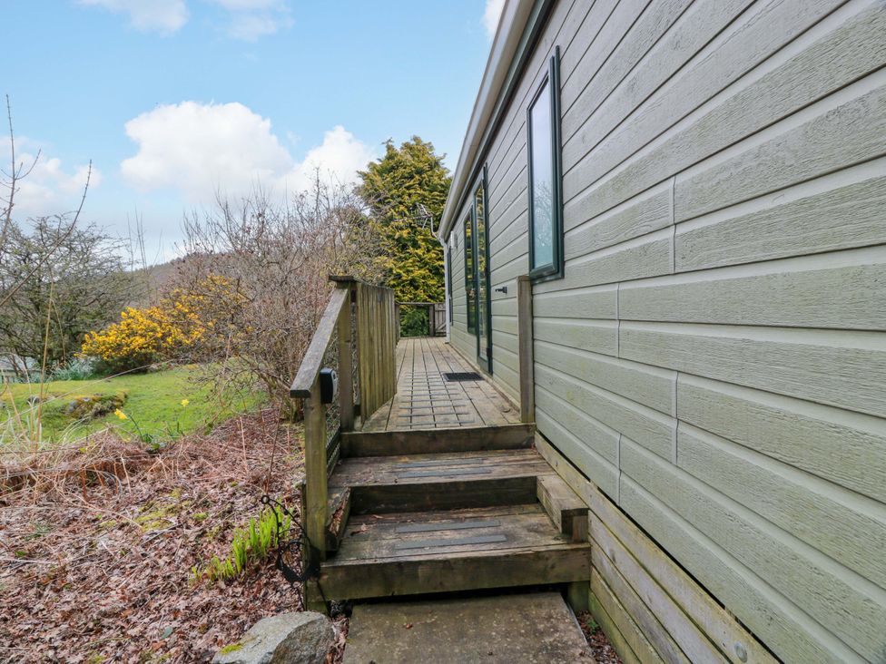 An outdoor area with steps leading to a house at L21 Coastal Kippford in Kippford near Sandyhills