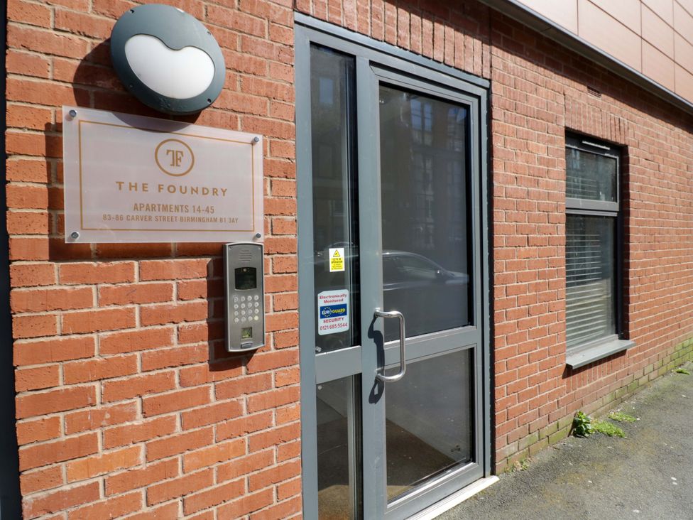 An entrance with a door and intercom at The Foundry in Birmingham