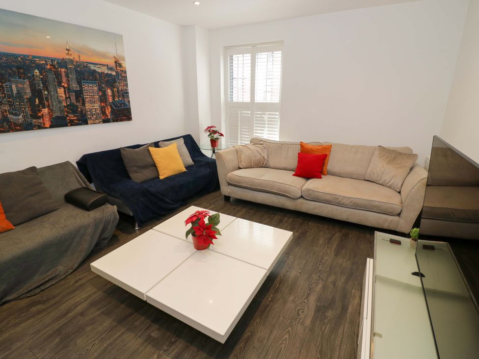 A living room with sofas and a coffee table at Apartment 15 in Birmingham