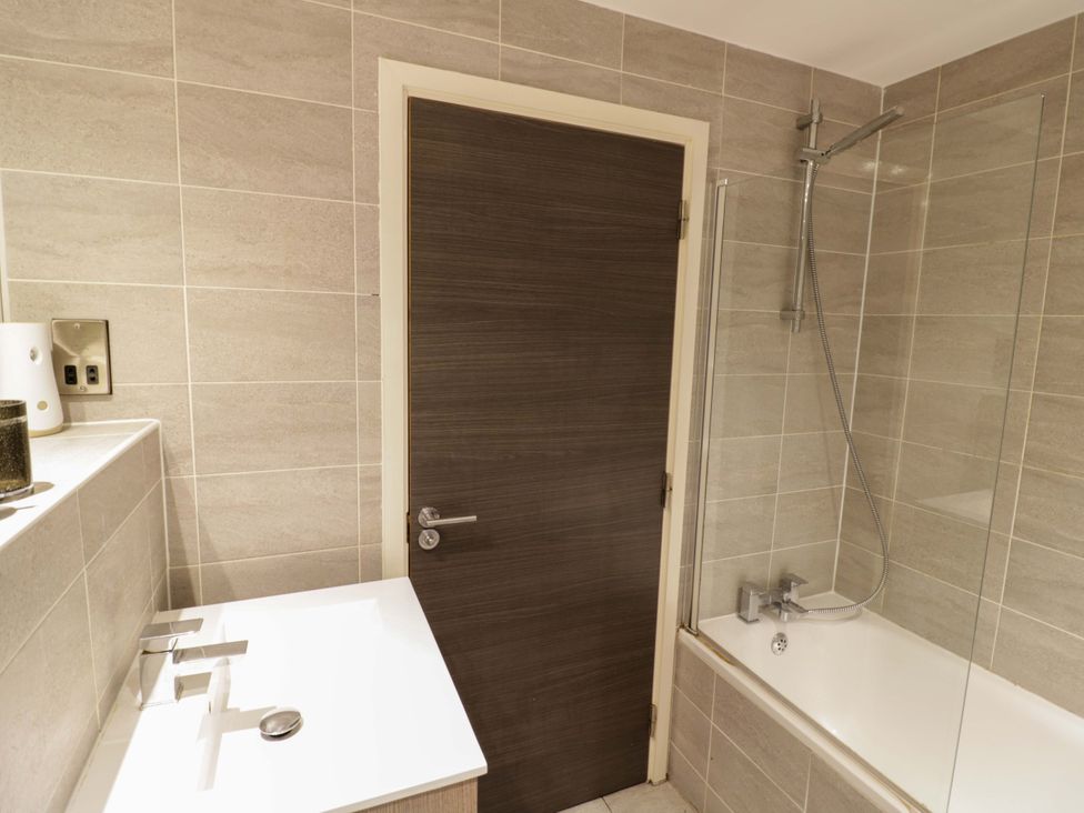 A bathroom with a sink and bath tub at Apartment 15 in Birmingham