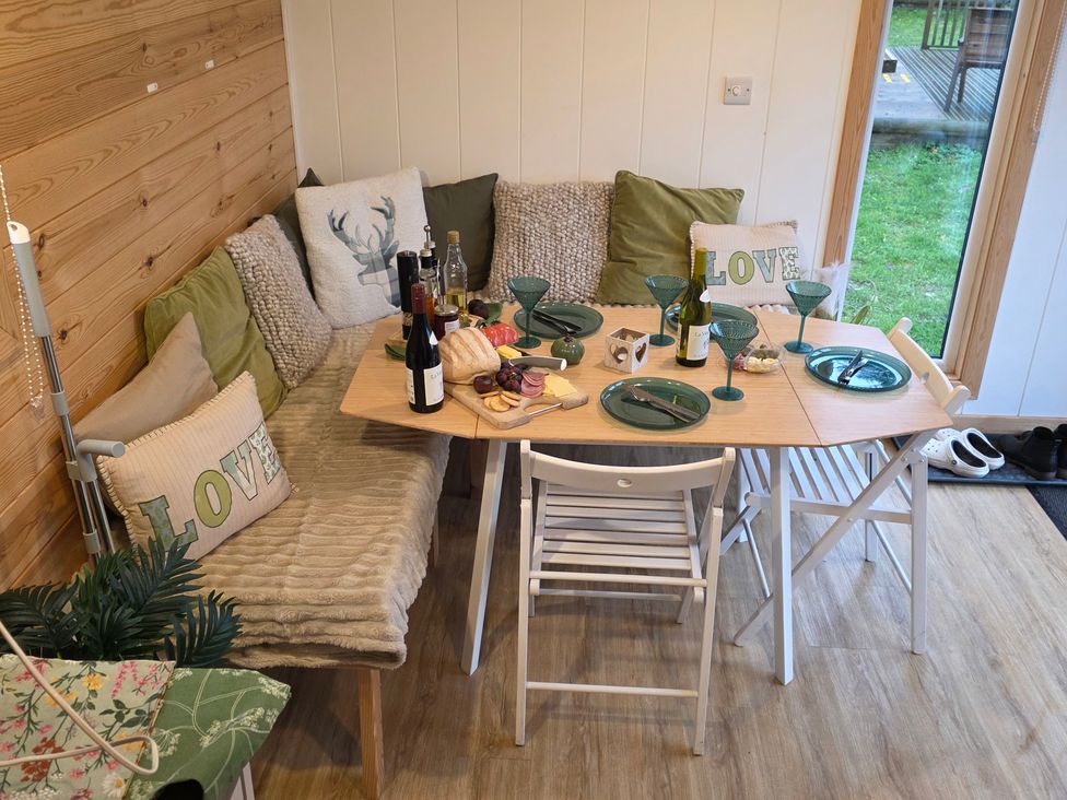 A dining room with a table set for a meal at Sherwood - Family Pod 1 Mansfield