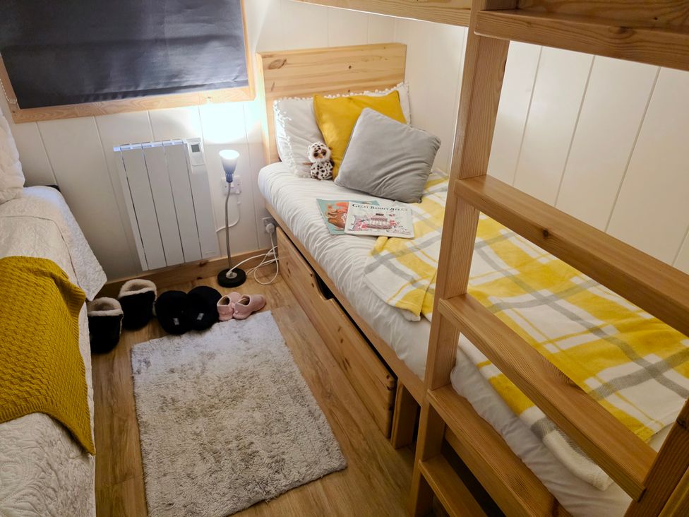 A bedroom with a bed and a ladder at Sherwood - Family Pod 3 in Mansfield