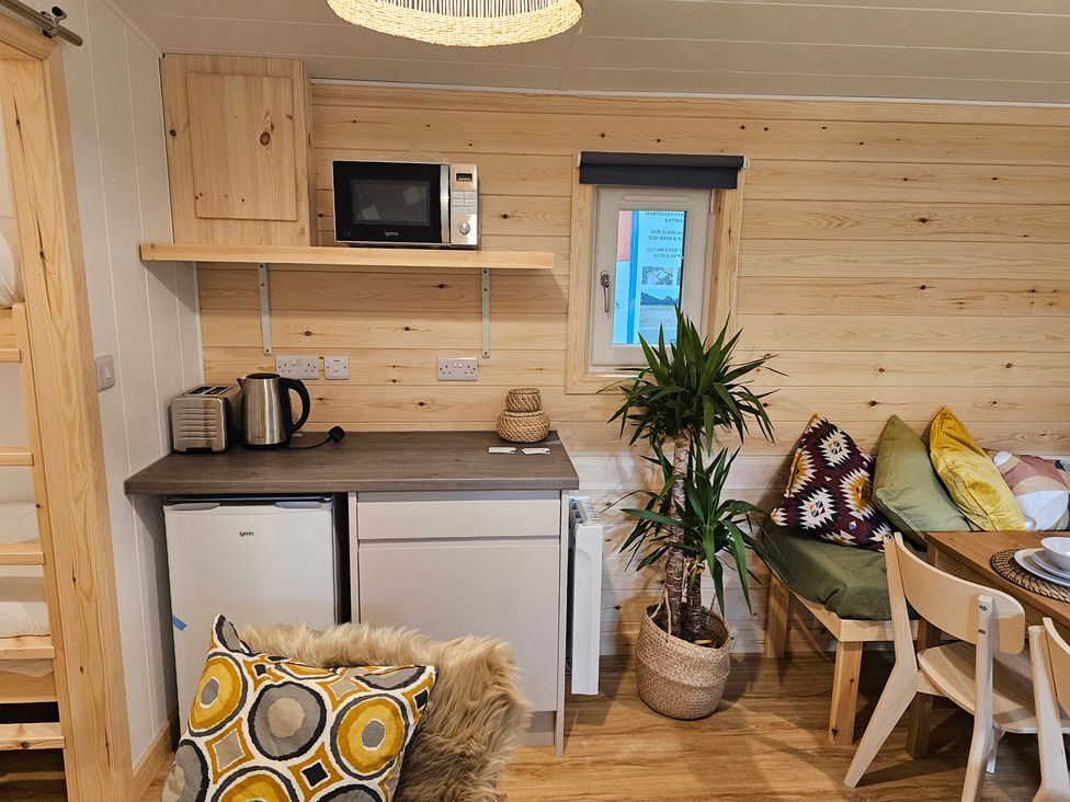 A kitchen with a fridge and microwave at Sherwood - Family Pod 4 in Mansfield