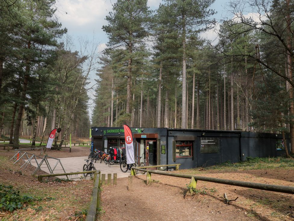 A bike rental building in a forest at Sherwood - Deluxe Pod 2 Mansfield