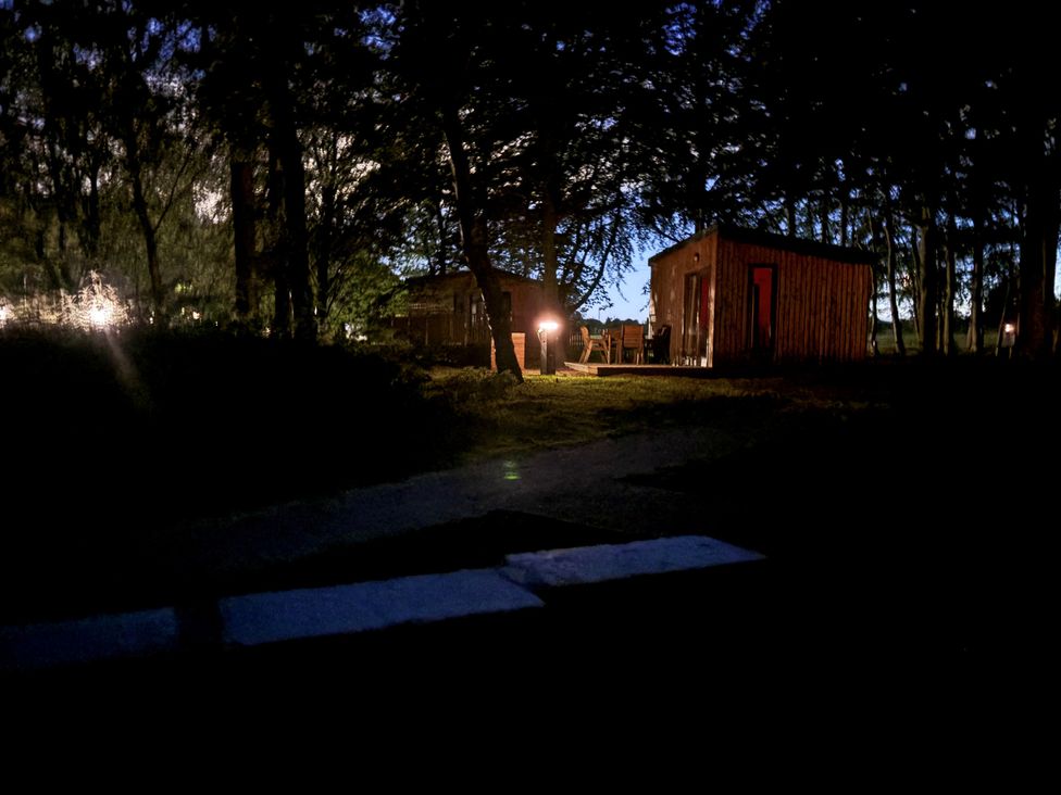 A view of cabins and outdoor furniture at Sherwood Pines - Deluxe Pod 2 near Edwinstowe