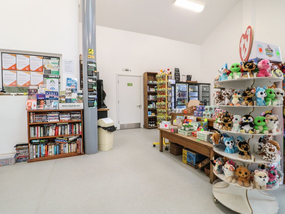 A store interior with shelves of books and plush toys at Sherwood - Deluxe Pod 3 in Mansfield