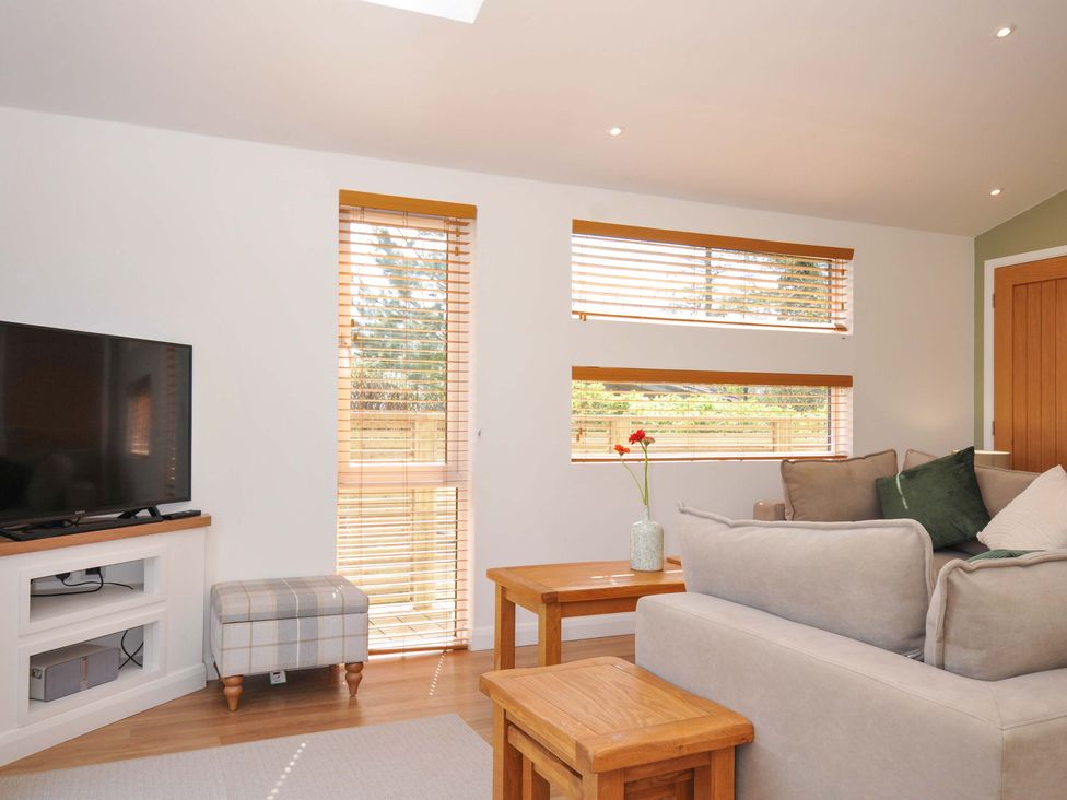 A living room with a television and coffee table at 3 Faraway Fields in Dobwalls