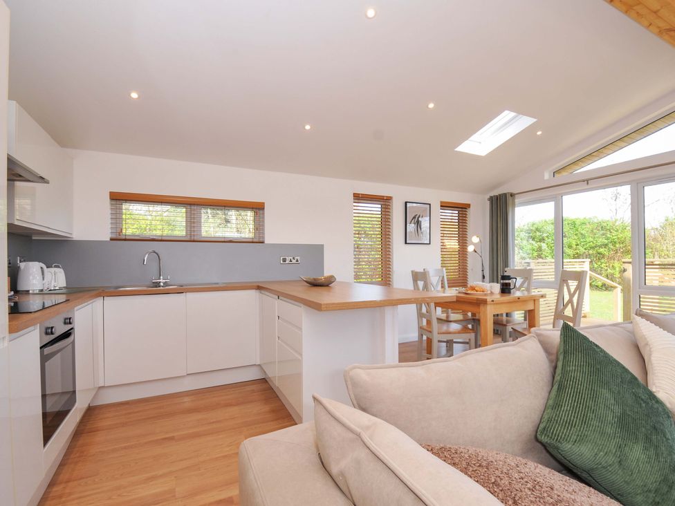 A kitchen with a countertop and dining area at 3 Faraway Fields in Dobwalls