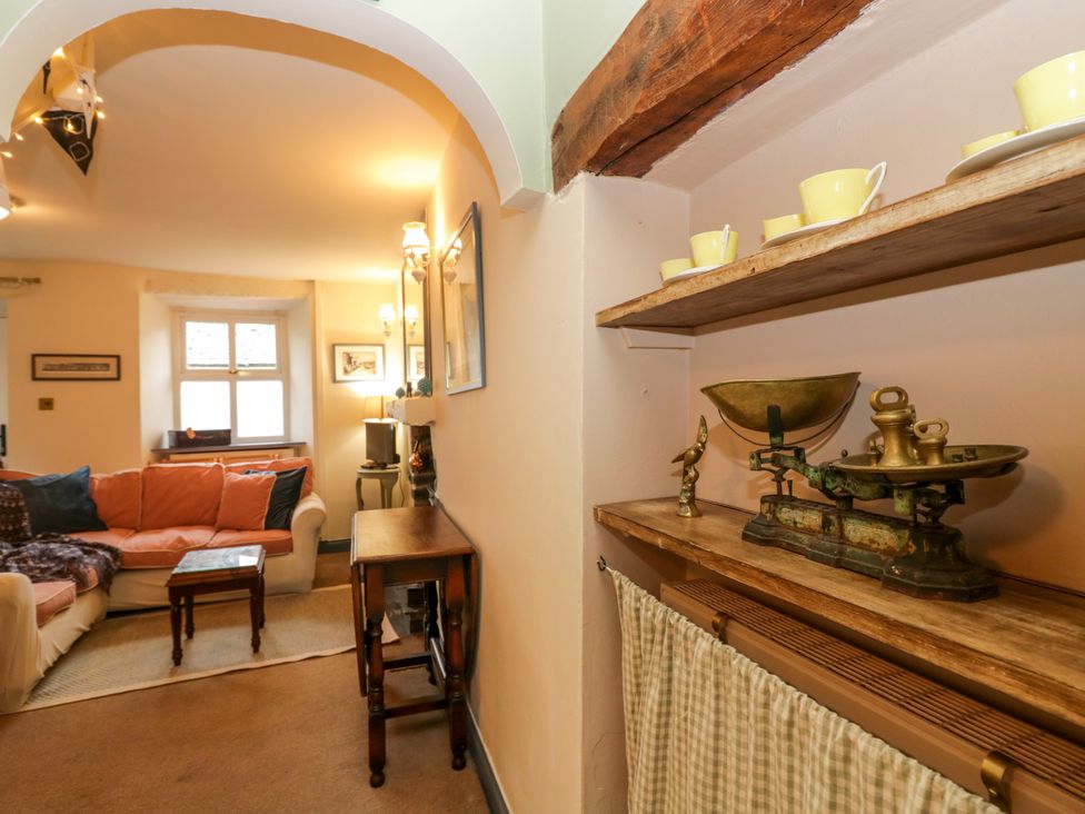 A living room with a couch and coffee table at Corner Cottage Lowick Green near Ulverston