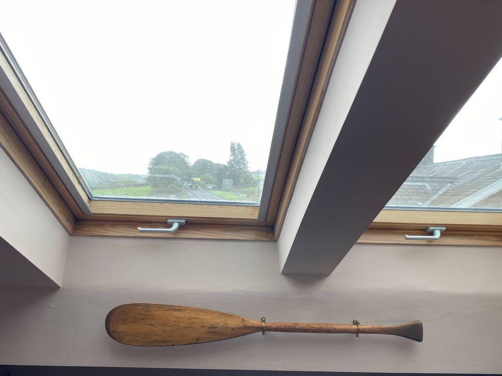 A skylight and wooden paddle in a room at Corner Cottage Lowick Green near Ulverston