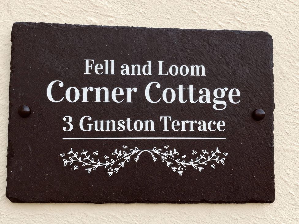 A sign for Corner Cottage at 3 Gunston Terrace, Fell and Loom, located in Lowick Green near Ulverston