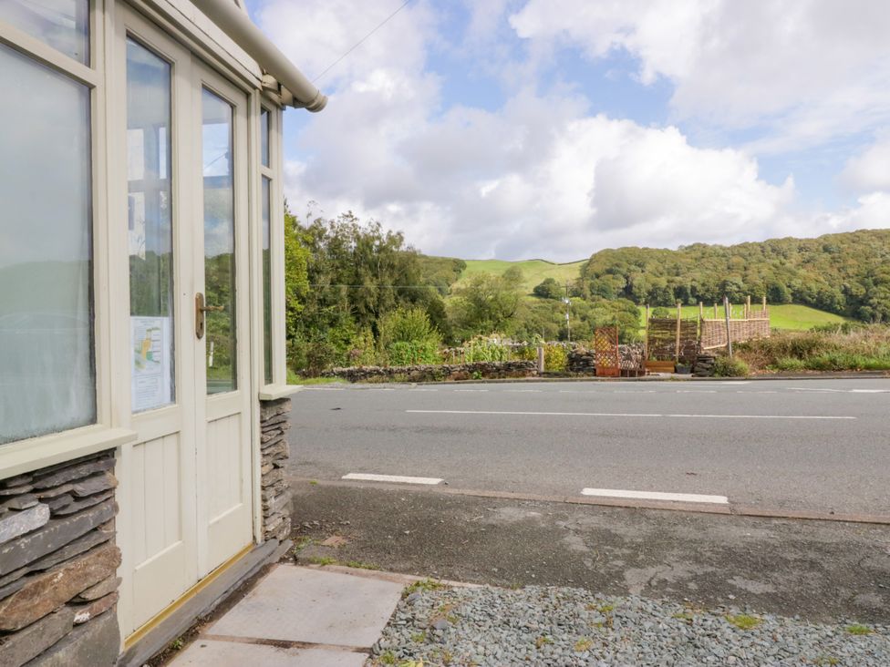 A view of a road and field from the corner of a building at Corner Cottage Lowick Green near Ulverston