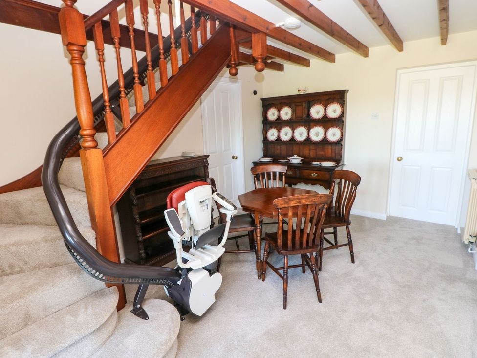 A dining room with a table and chairs at Park Hall Cottage in Solva