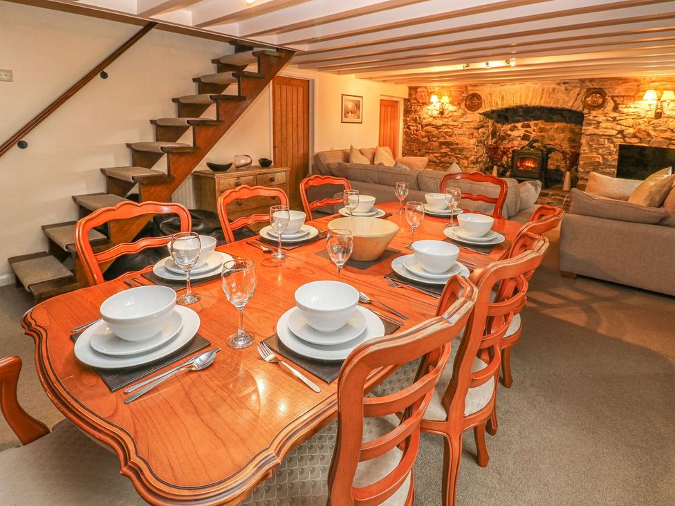 A dining room with a table set for meals at Maerdy Lodge 