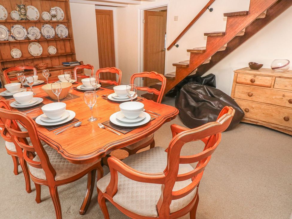 A dining room with a table set for dinner at Maerdy Lodge