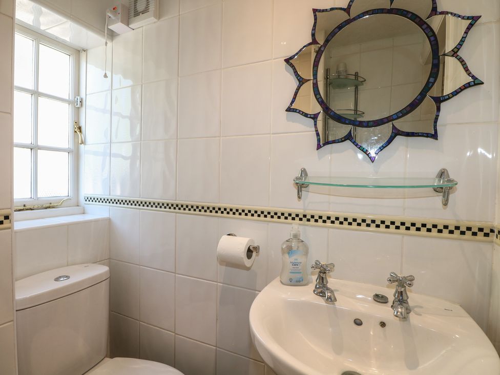 A bathroom with a toilet and sink at The Old School House in Chichester