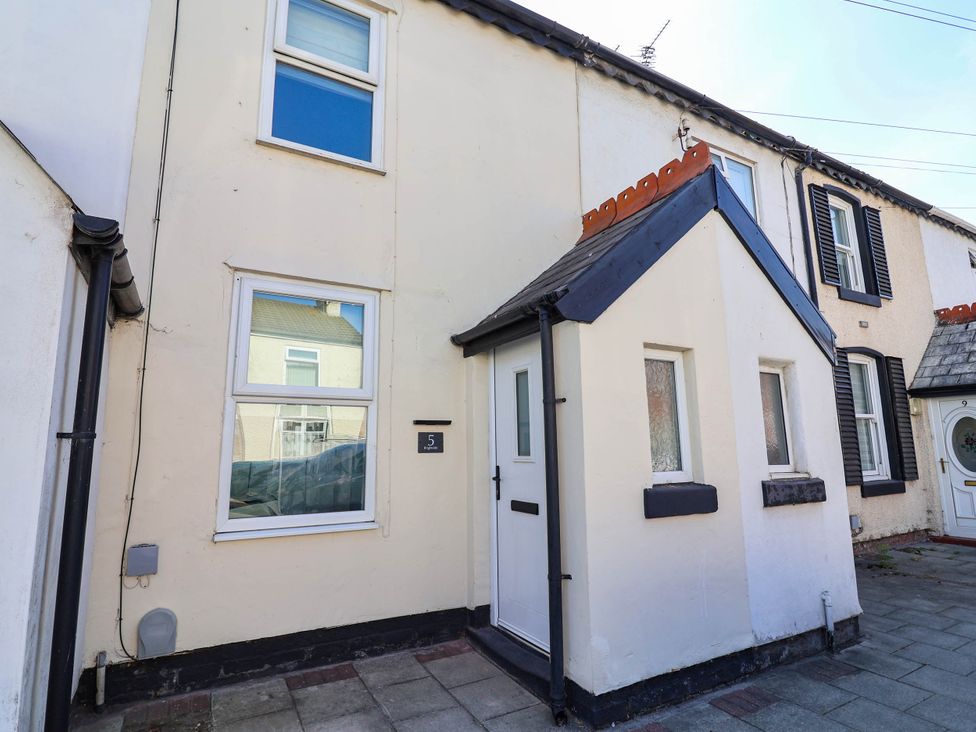 A house exterior with windows and a door at Brightside in Hoylake