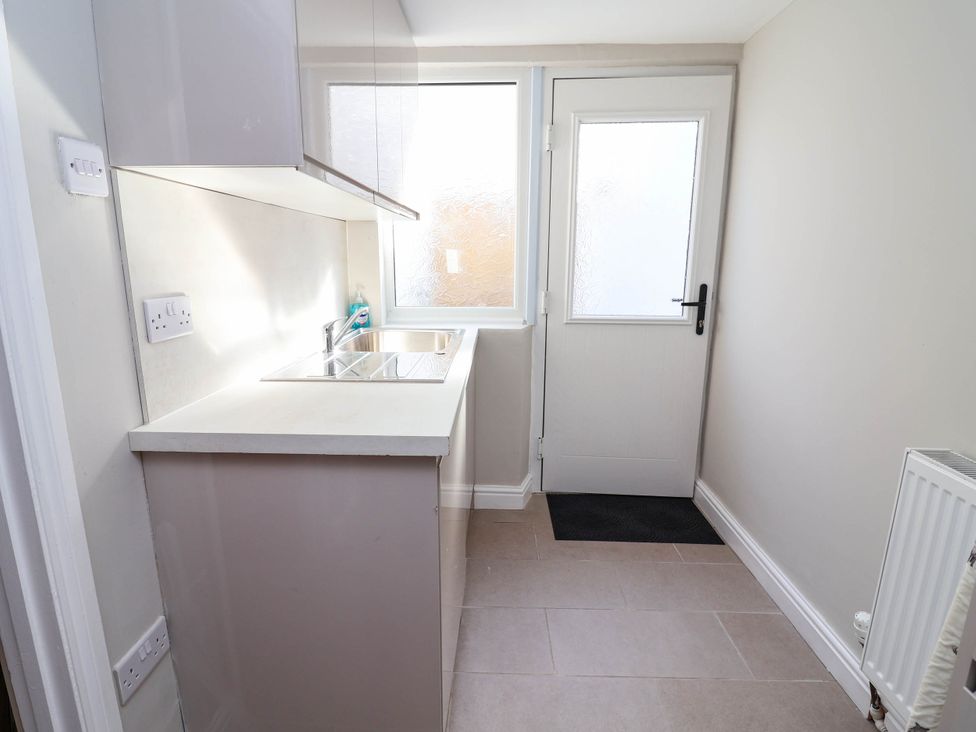 A kitchen with a sink and countertop at Brightside in Hoylake