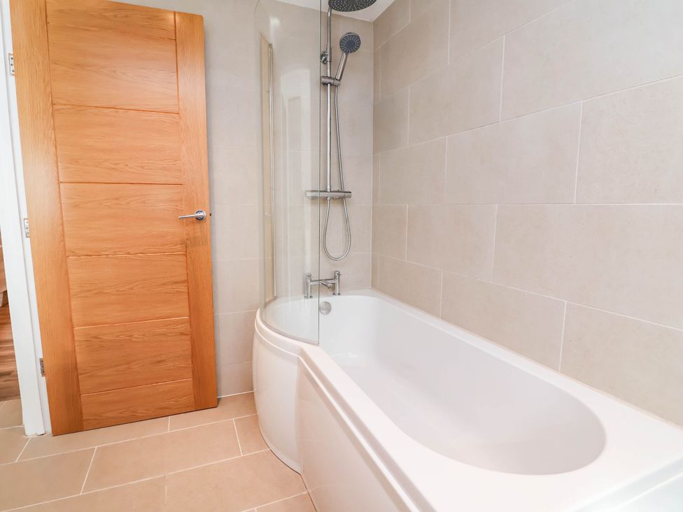 A bathroom with a bathtub and shower at Brightside in Hoylake