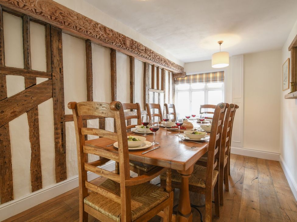 A dining room with a table set for a meal at Beresford House in Woodbridge
