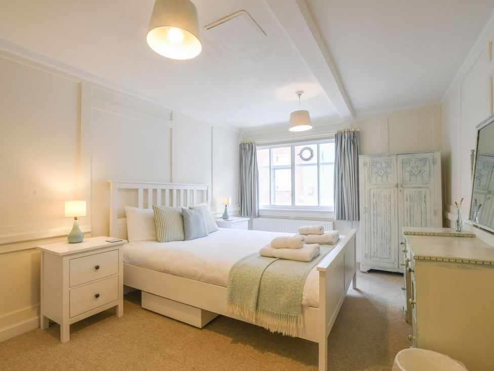 A bedroom with a bed and furniture at Beresford House in Woodbridge