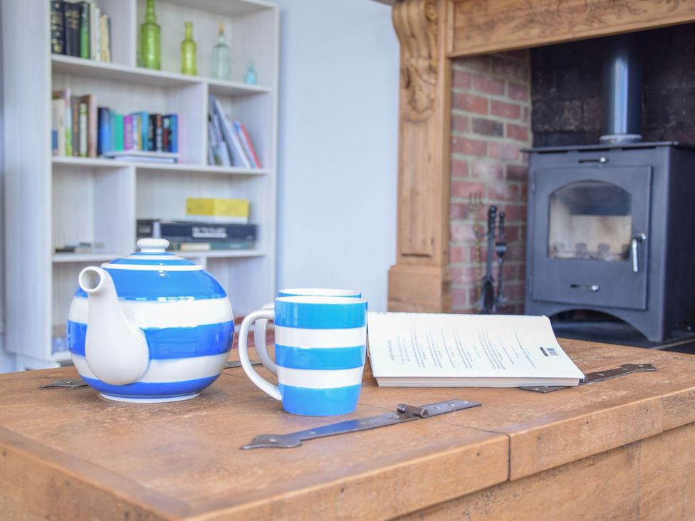 A living room with a teapot and mug on a table at Beresford House in Woodbridge