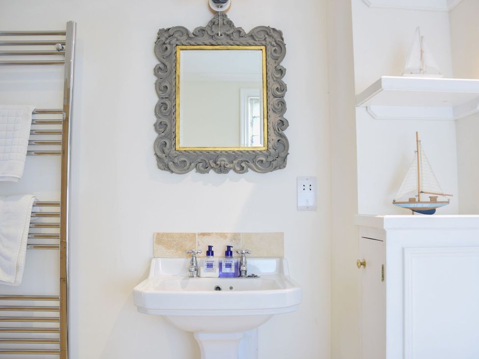 A bathroom with a sink and a mirror at Beresford House in Woodbridge
