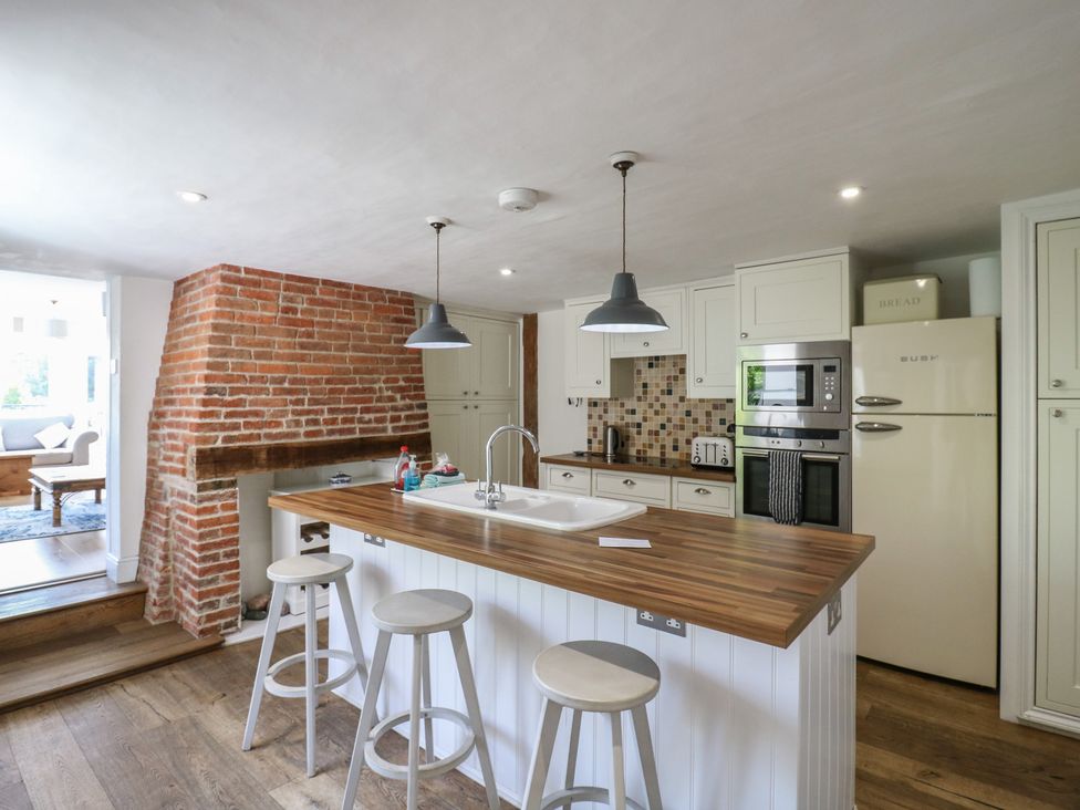 A kitchen with an island and appliances at Beresford House in Woodbridge
