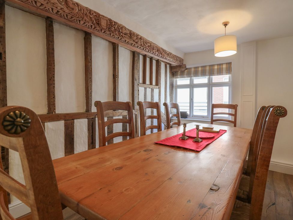 A dining room with a wooden table and chairs at Beresford House in Woodbridge