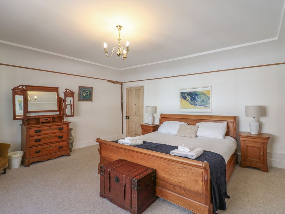 A bedroom with a bed and furniture at Beresford House in Woodbridge
